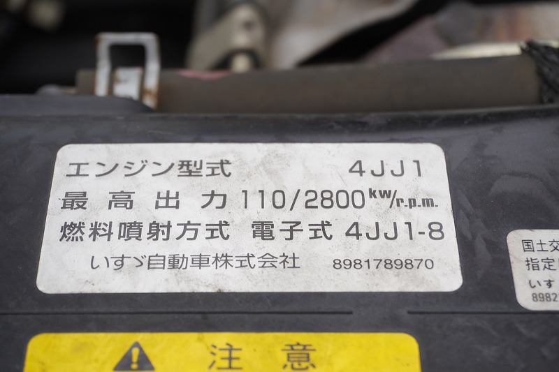 エルフ　高所作業車　アイチ製（ＳＨ１０Ａ）　積載１００ｋｇ　最大地上高９．９ｍ　ＦＲＰバケット　ブーム自動格納　バケット積載荷重２００ｋｇ　ジョイスティックタイプ　アワーメーター：１４８５ｈ　バックカメラ　社外ナビ　坂道発進補助　通信工事仕様！６速ＭＴ！11