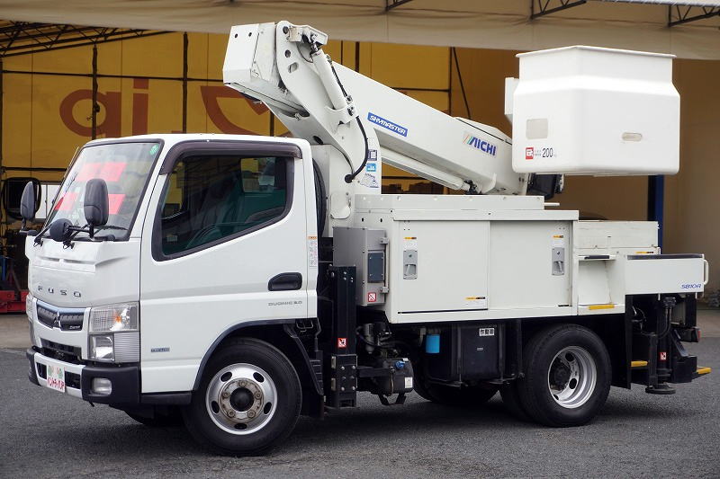 キャンター　高所作業車　アイチ製（ＳＢ１０Ａ）　最大地上高９．７ｍ　ＦＲＰバケット　バケット積載荷重２００ｋｇ　積載２５０ｋｇ　工具入れ　ジョイスティックタイプ　アワーメーター：２８１０ｈ　左電格ミラー　社外ナビ　バックカメラ　ＥＴＣ２．０　フォグランプ　通信工事仕様！ＡＴ車！フロント画像